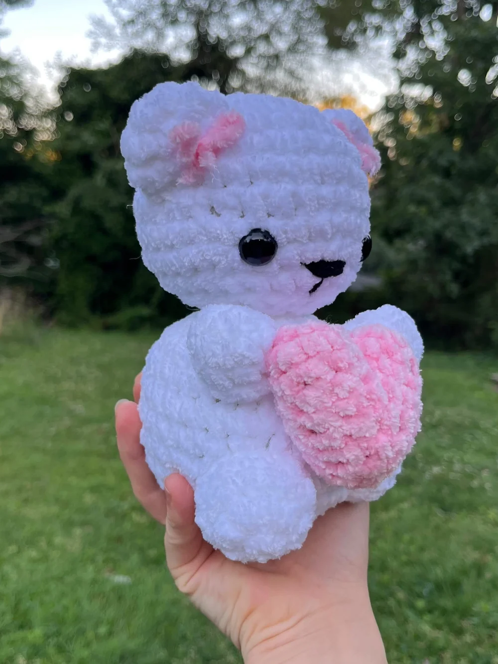 crochet handmade white bear plushie holding pink heart